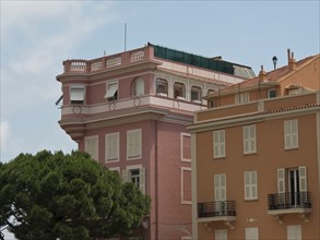 Classic buildings with pink facades and white shutters, monte carlo, monaco, france