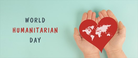Red heart with world map, humanitarian help day, charity, support and volunteering concept