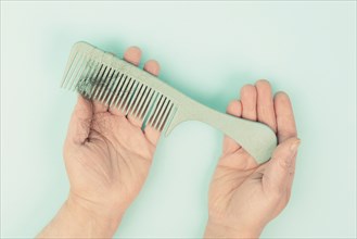 Comb with hair loss, health problem, issue of aging, alopecia areata by stress or infection,