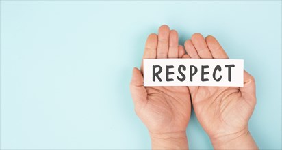The word respect is standing on a paper, responsibility, tolerance and development, human