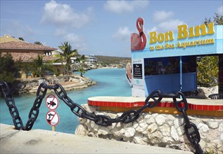 Sign with on island in country Curacao typical welcome greeting Bon Boni in entrance area of Sea