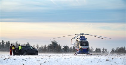 Air rescue helicopter from Luxembourg, emergency transport in Trier, misson in snow, winter