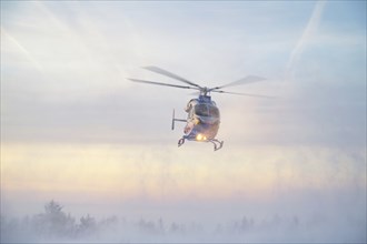 Air rescue helicopter from Luxembourg, emergency transport in Trier, misson in snow, winter