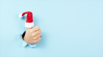 Thumb up, Santa Claus hat, Christmas holiday, positive hand gesture, optimism and emotion, winter