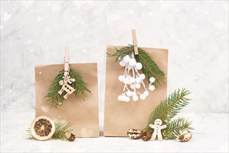 Christmas holiday gift bags for suprise, fir branches, gingerbread man, elk, snow covered berries