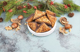 Nut corner triangles, traditional german sweets called Nussecke, covered with chocolate, christmas