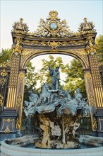 Neptune Fountain at the Place Stanislas in Nancy, France, departement Lorraine, golden gate, Europe