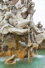 Statue of the god Zeus in Bernini's Fountain of the Four Rivers in Piazza Navona, Rome. Detail of
