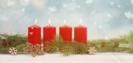 Red candles on a advent wreath with fir, christmas decoration with candlelight, winter holiday