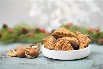 Nut corner triangles, traditional german sweets called Nussecke, covered with chocolate, christmas