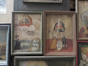 Votive pictures, votive tablets on the walls of the chapel of grace inside the church, pilgrimage