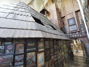 Votive pictures, votive tablets on the walls of the chapel of grace inside the church, pilgrimage