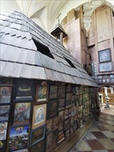 Votive pictures, votive tablets on the walls of the chapel of grace inside the church, pilgrimage