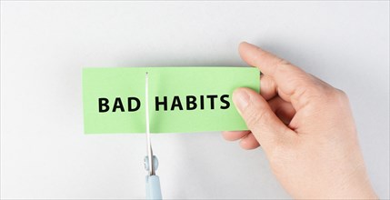 Bad habits sign cut with scissors, break a habit, stop smoking, quit drinking alcohol and unhealthy