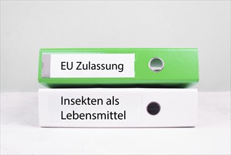 EU authorization, insects in food is standing in german language on the file folder, permission for