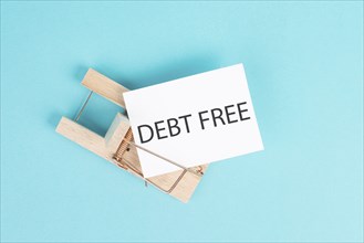 Debt free is standing on a paper, ending credit payments and bank loans, financial freedom, trapped