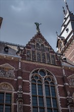 Historic Gothic façade of the Rijksmuseum made of bricks with decorations, Amsterdam, Netherlands