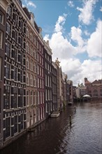 Historic house facades along a canal, Amsterdam, Netherlands