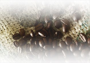 Coffee beans on coffee sack, close-up