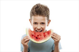 Handsome smiling child boy hand holding red ripe watermelon fruit food slice white isolated