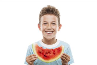 Handsome smiling child boy hand holding red ripe watermelon fruit food slice white isolated