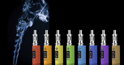 Eight multicolored electronic cigarettes and smoke, isolated on black background