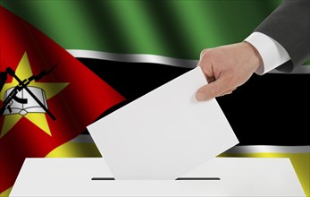 The Mozambique flag and the hand with the bulletin about the ballot box