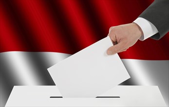 The Indonesian flag and the hand with the bulletin about the ballot box