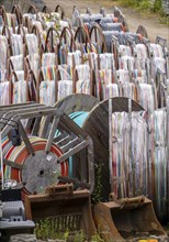 Cable drums with conduits for fibre optic cables, in a storage yard, North Rhine-Westphalia,