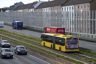 The A40 motorway, Ruhrschnellweg, in Essen, residential buildings directly on the motorway, glass