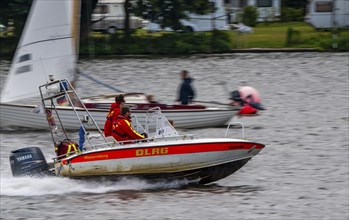 Lake Baldeney, sailing boat, DLRG rescue boat on an alarm trip, Essen, North Rhine-Westphalia,