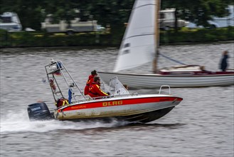 Lake Baldeney, sailing boat, DLRG rescue boat on an alarm trip, Essen, North Rhine-Westphalia,