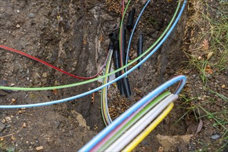 Laying of fibre optic cables, construction site, excavation pit, connection for fast Internet, near