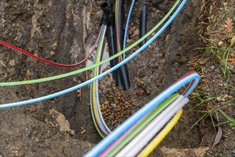 Laying of fibre optic cables, construction site, excavation pit, connection for fast Internet, near