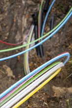 Laying of fibre optic cables, construction site, excavation pit, connection for fast Internet, near