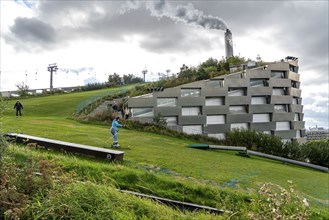 CopenHill, waste incineration plant and artificial ski slope, skiing with a view of the ski lift,