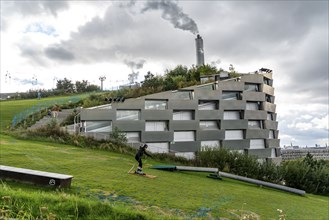 CopenHill, waste incineration plant and artificial ski slope, skiing with a view of the ski lift,