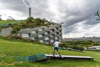 CopenHill, waste incineration plant and artificial ski slope, skiing with a view of the ski lift,