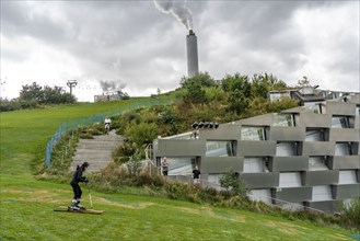 CopenHill, waste incineration plant and artificial ski slope, skiing with a view of the ski lift,