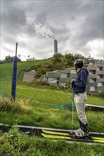 CopenHill, waste incineration plant and artificial ski slope, skiing with a view of the ski lift,