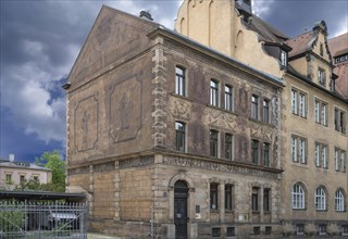 Historic residential building with frescoes on the facades, today esg Café, Evangelische