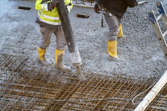 Construction site, concreting, floor, ceiling for a building is concreted, the concrete is pumped