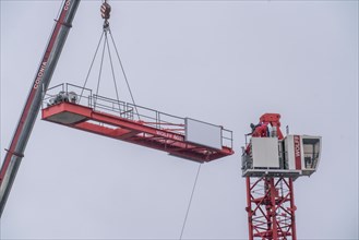 Dismantling of a large construction crane, on a large construction site, housing construction,