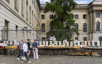 Tourists at the flea market stall in front of Humboldt University, Unter den Linden, Berlin,