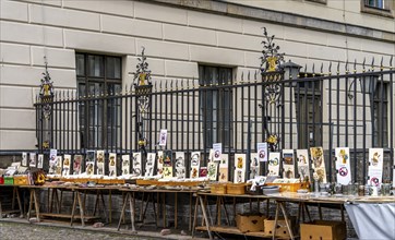 Tourists at the flea market stall in front of Humboldt University, Unter den Linden, Berlin,