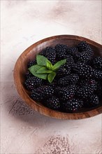 Blackberries, in a wooden bowl, top view, no people