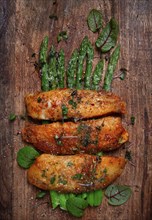 Fried fish fillet, tilapia with asparagus, homemade, no people