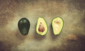 Fresh sliced avocado on the table, top view, food background, concept, menu, food styling