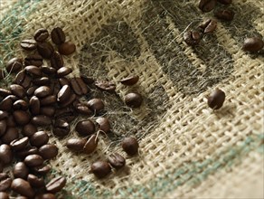 Coffee beans on coffee sack, close-up