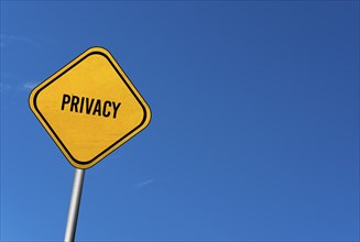 Privacy, yellow sign with blue sky